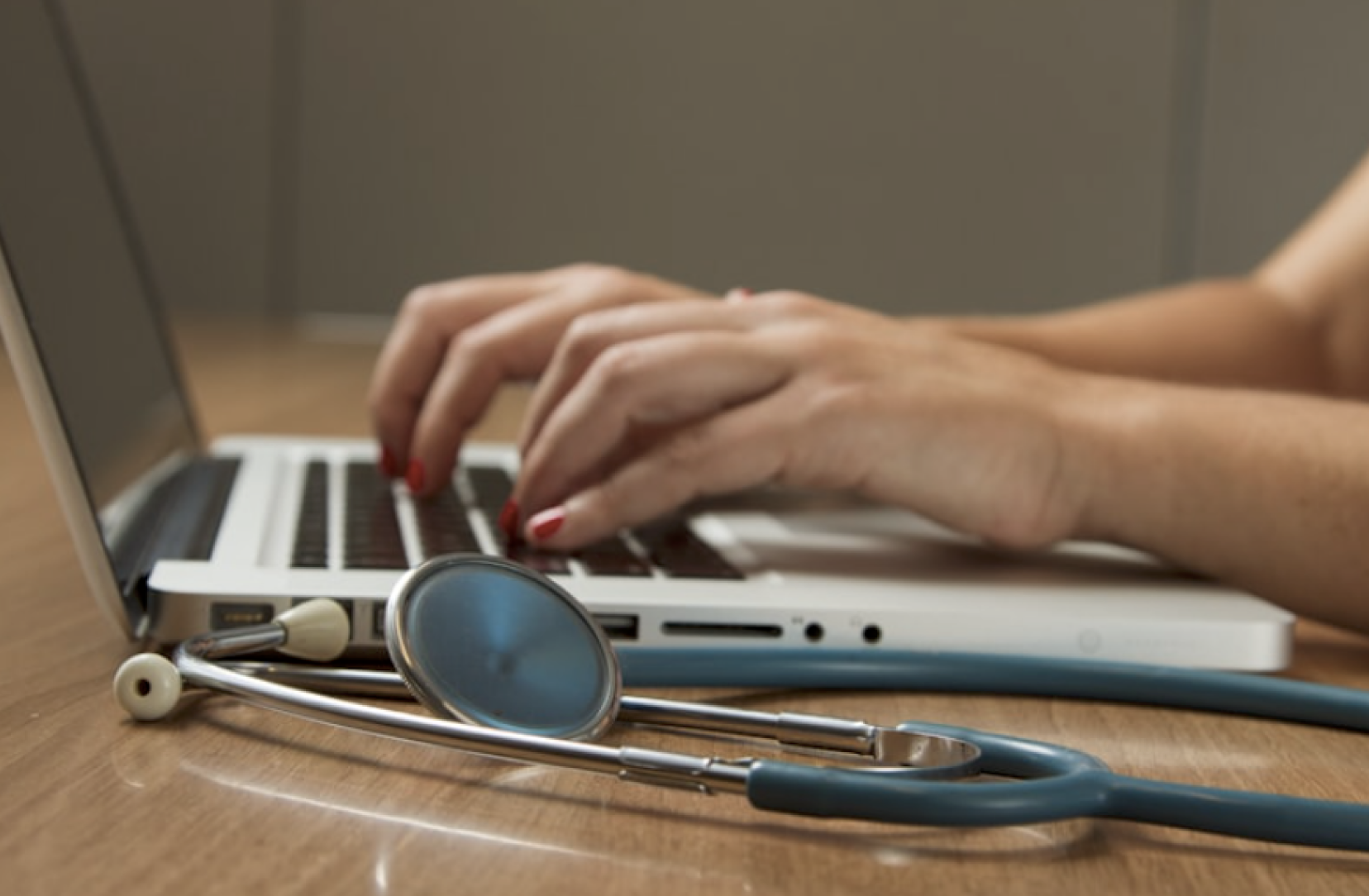 Physician reviewing clinical data on screen